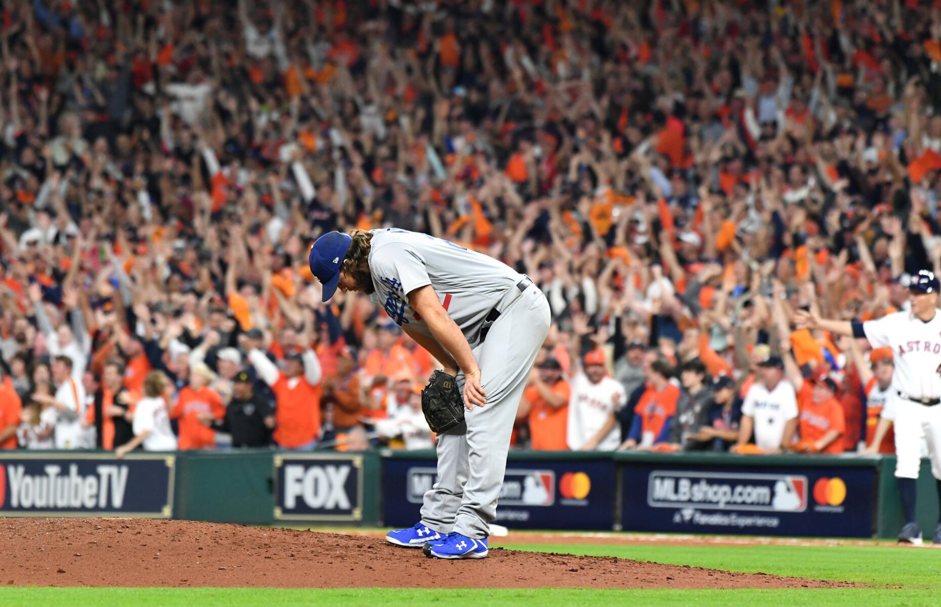 Dodgers pitcher Clayton Kershaw reacts after giving up a three-run home run to the Houston Astros.